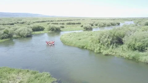 Paddling aboard a Hammocraft down a River II Stock Footage 85625586
