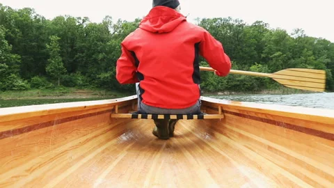 Paddling canoe on cloudy day Stock Footage 131297034