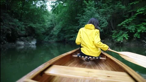 Paddling canoe in the rainforest Stock Footage 249669134