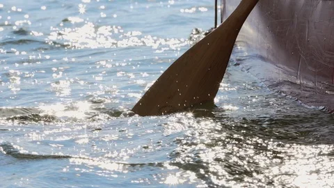 Paddling a canoe in slow motion Stock Footage