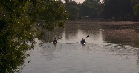 Paddling down a scenic river on a beautiful summer day Stock Footage 133756261