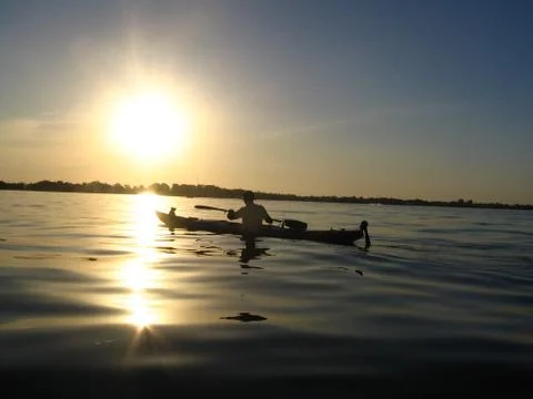 Paddling at sunset Foto stock