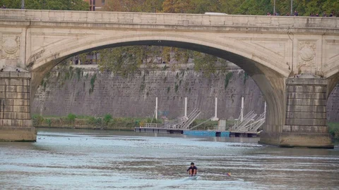 Paddling through the Tiber river in Rome Italy Stock Footage 89812716