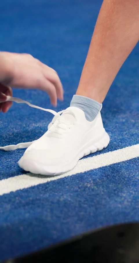 Padel, help and person tie shoes in court for training, exercise and prepare for Vídeo Stock 335908543