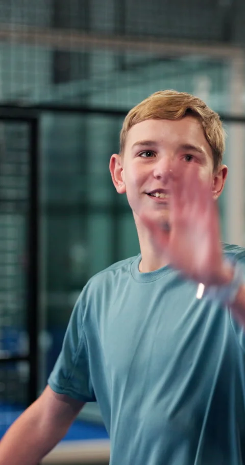Padel, high five and child with trainer on court for learning to serve for game Stock Footage 335903613