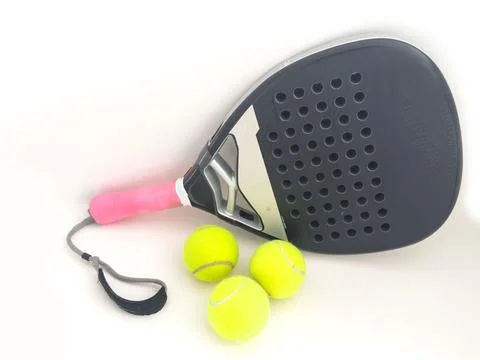 Padel racket and ball reflected on white table and white isolated background Stock Photos