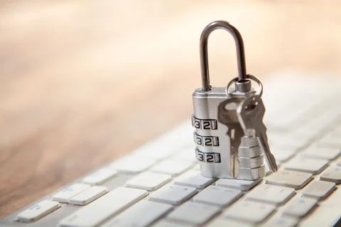 Padlock and key on computer keyboard, security and data protection concept Foto stock