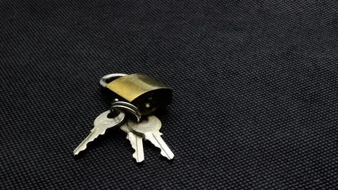 Padlock and key isolated Stock Photos