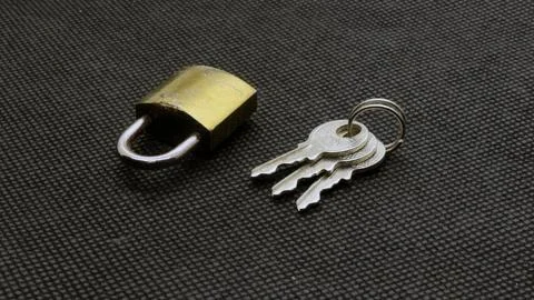 Padlock and key isolated Stock Photos