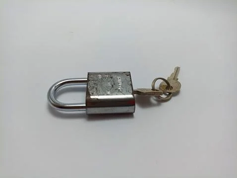 Padlock and key on white background Stock Photos