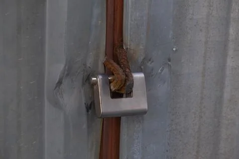 Padlock and rusty iron ring Stock Photos