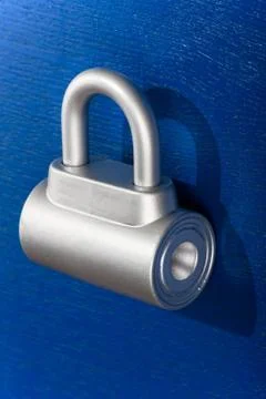 Padlock on blue background Stock Photos