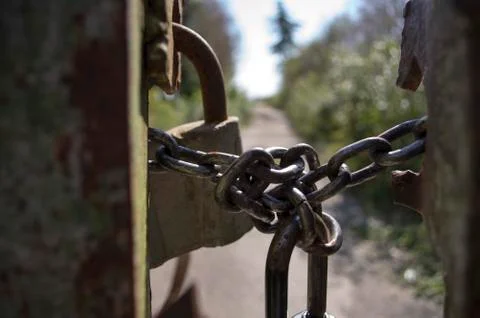 Padlock on the chain the gate Stock Photos