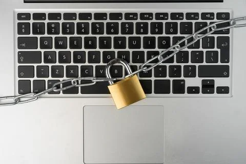 Padlock with chain on a laptop computer. Stock Photos