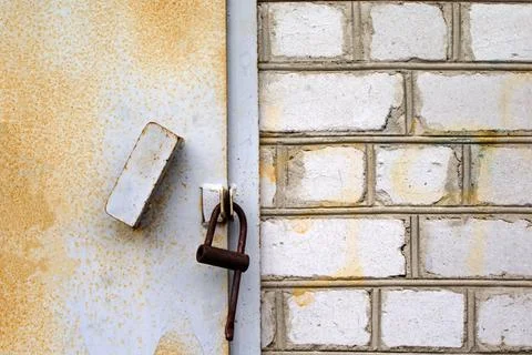 Padlock on closed door Stock Photos