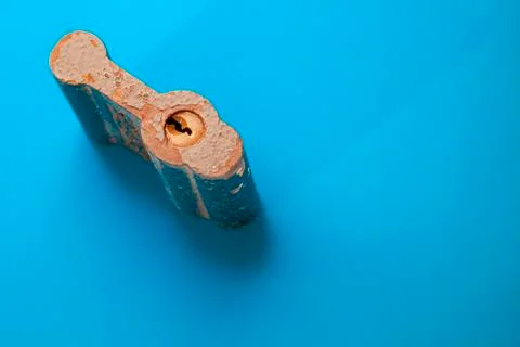 Padlock closeup on blue background Stock Photos