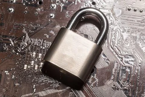 Padlock on a computer circuit board 스톡 사진