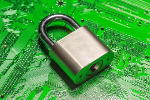 Padlock on a computer circuit board 스톡 사진