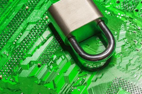 Padlock on a computer circuit board 스톡 사진
