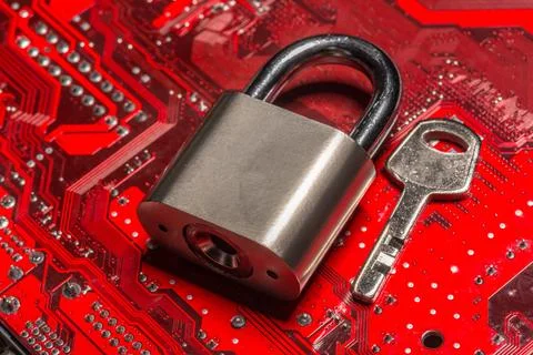 Padlock on a computer circuit board 스톡 사진