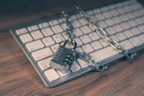 Padlock on computer keyboard with chain and padlock, security concept Stock-Fotos
