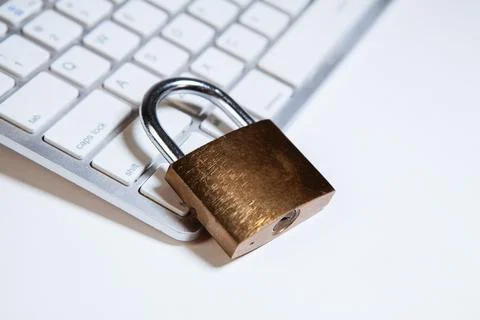 Padlock on a computer keyboard. Concept of security, data protection. Stock Photos