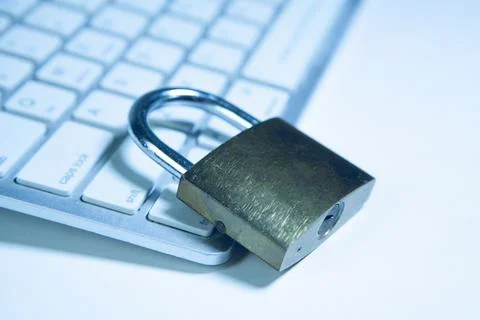 Padlock on a computer keyboard. Internet security concept. Blue tone. 写真素材