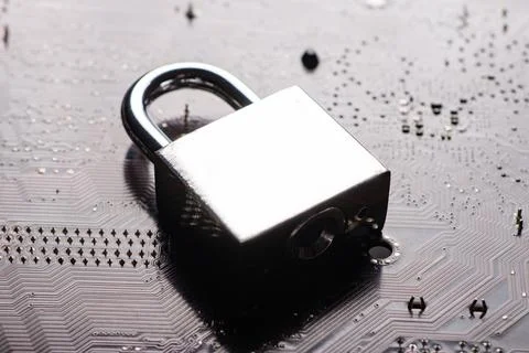 Padlock on computer motherboard. Internet data privacy information security.. Foto stock