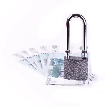 The padlock on a few banknotes Stock Photos