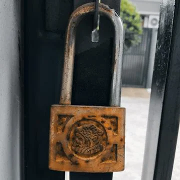 Padlock key Stock Photos