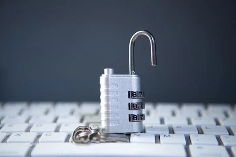 Padlock on keyboard with key. security concept. Stockfoto's