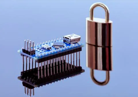 Padlock next to the computer chip - the concept of electronic data protection Stock Photos