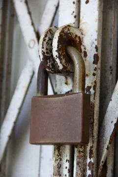Padlock on old gate Stock Photos