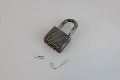 Padlock opened with paper clip Stock Photos