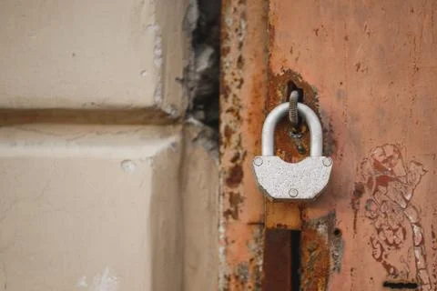 Padlock on a rusty door Stock Photos