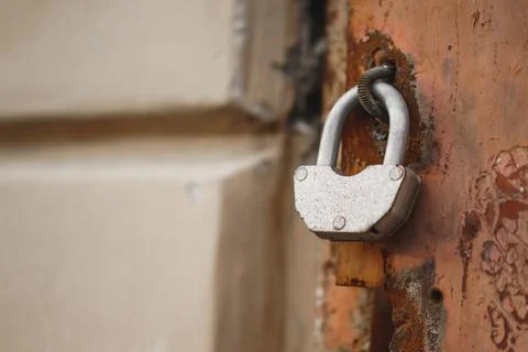 Padlock on a rusty door Stock Photos