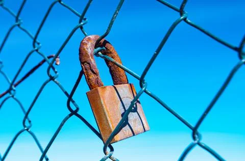 Padlock rusty by the passage of time Stock Photos