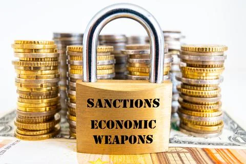 Padlock with "sanctions, economic weapons" text next to money. Economic sanction Stock Photos