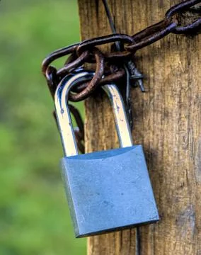Padlock secured with a chain Stock Photos