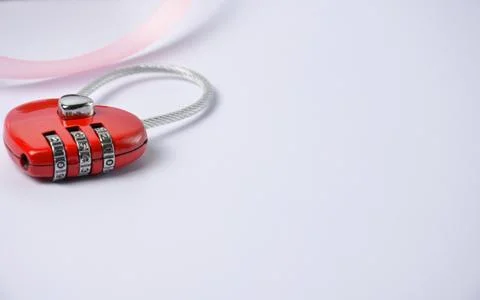Padlock in the shape of a heart on a blue background. Valentine's Day. Stock Photos