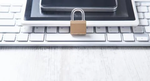 Padlock with smartphone, keyboard, tablet. Security Stock Photos