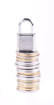 The padlock on the stack of coins Stock Photos
