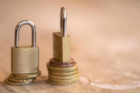 Padlock on Stack of Euro Coins for Financial Security Concept Stock Photos
