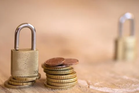 Padlock on Stack of Euro Coins for Financial Security Concept Stock Photos