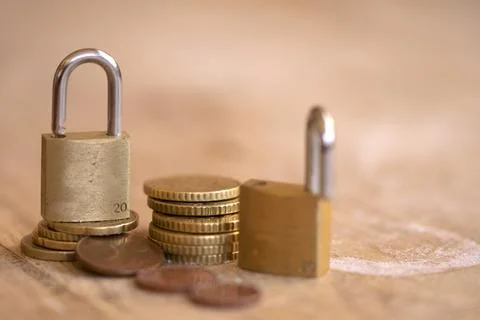 Padlock on Stack of Euro Coins for Financial Security Concept Stock Photos