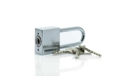 Padlock with three keys on white background Stock Photos