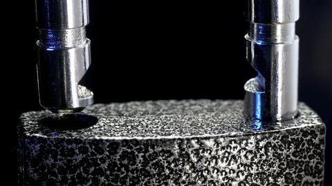 Padlock unlocking. Close-up shot. Stock Footage 74496398