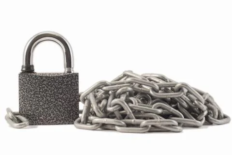 Padlock on a white background. The lock is locked. The chain is metal. Stock Photos