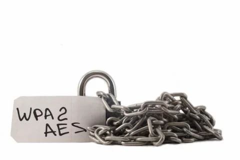 Padlock on a white background. The lock is locked. The chain is metal. Stock Photos
