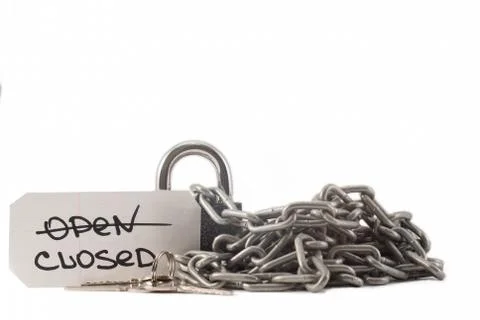 Padlock on a white background. The lock is locked. The chain is metal. Stock Photos